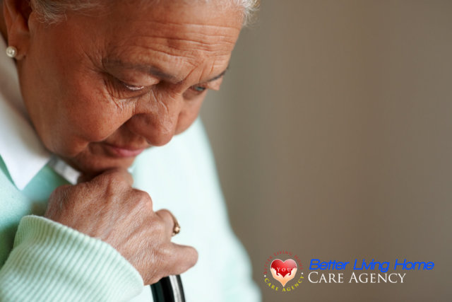 Tensed senior woman in a thoughtful mood