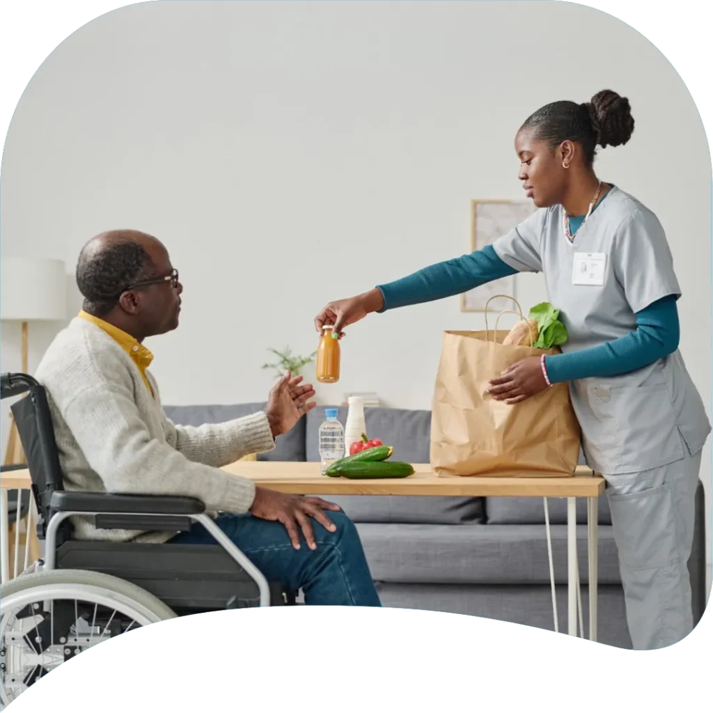 Homemaker helping an older adult with household tasks at home in Ackerman, MS